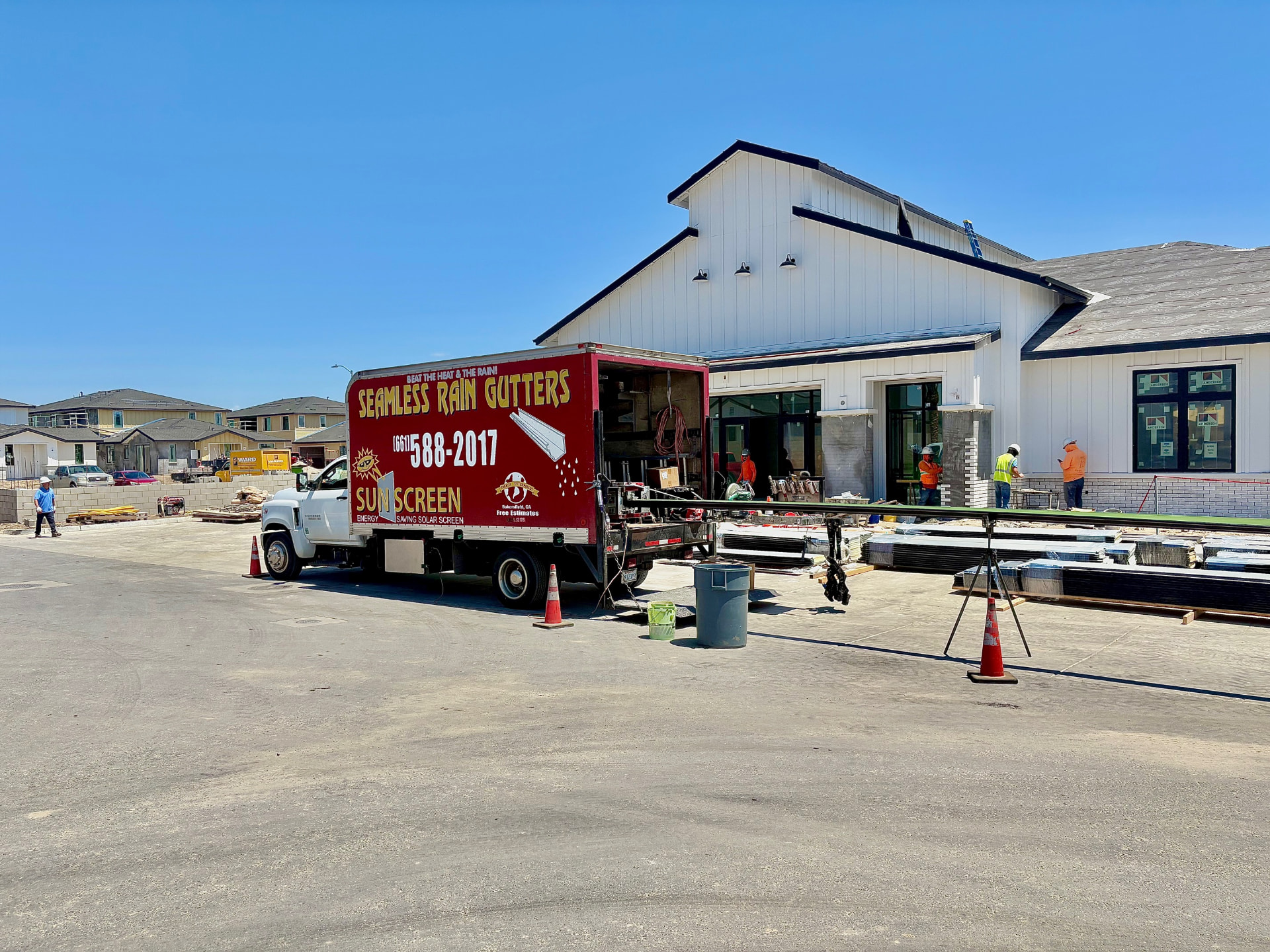 Seamless Rain Gutters & Sunscreen truck set up on a Central Valley job site